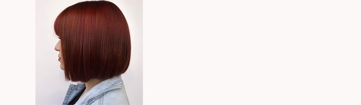 UGC image from Instagram, @avedaartists - redheaded bob haircut.